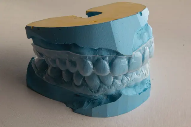 invisalign braces on a blue teeth mockup